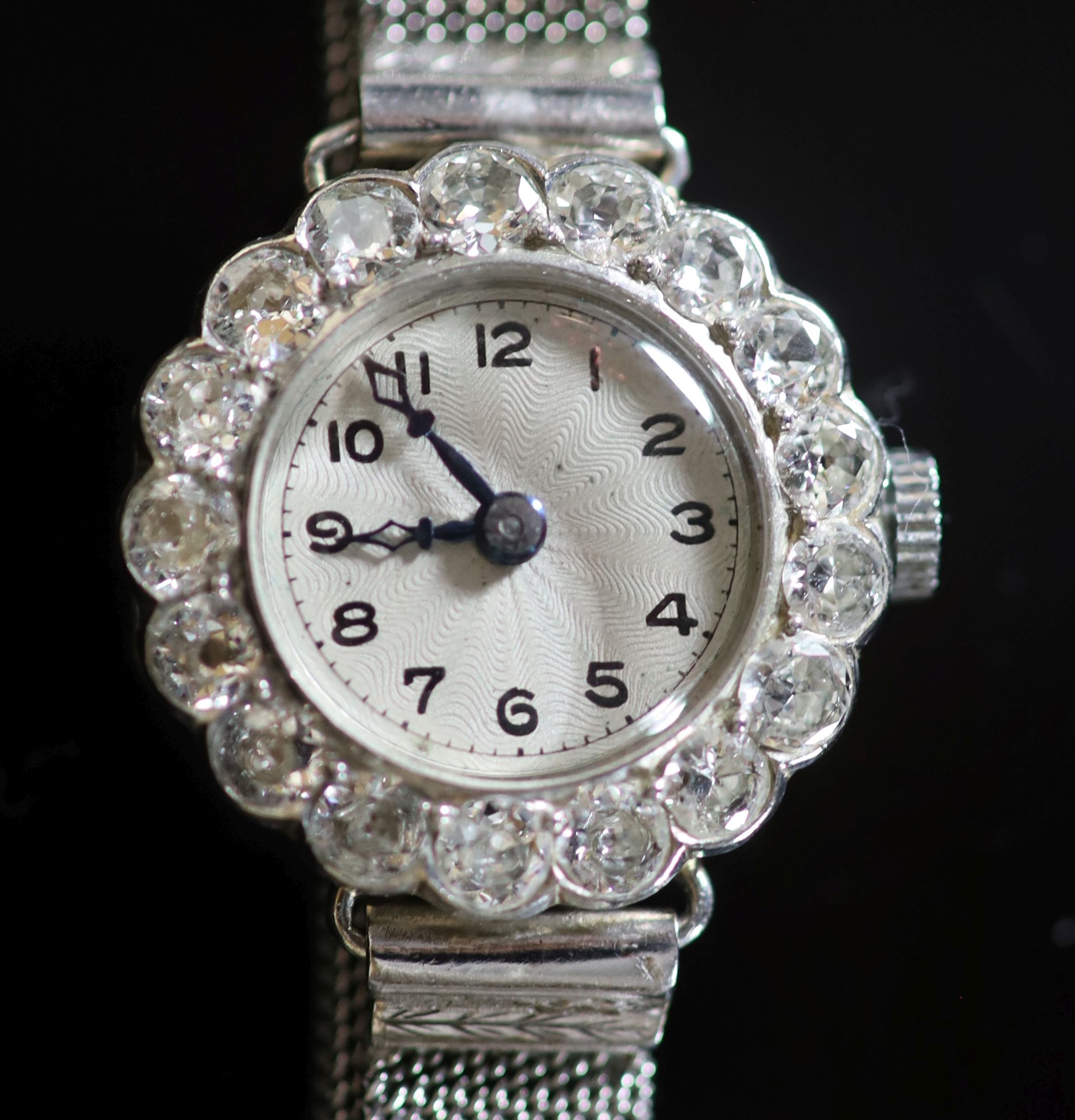 A lady's platinum and diamond set manual wind cocktail watch, on an 18ct white gold mesh link bracelet